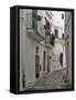 Italy, Puglia, Brindisi, Itria Valley, Ostuni. The narrow alleyways of the old town of Ostuni.-Julie Eggers-Framed Stretched Canvas