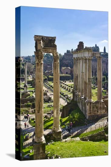 Italy, Rome, temple and arch ruins at Roman Forum-Michele Molinari-Stretched Canvas