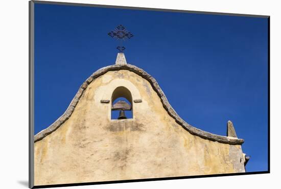 Italy, Sardinia, Gavoi. the Bell and Cross of an Old Church, Backed by a Blue Sky-Alida Latham-Mounted Photographic Print