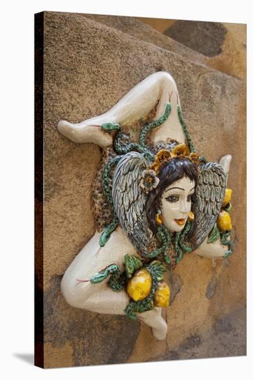 Italy, Sicily, Taormina, ceramic woman with lemons on wall.-Merrill Images-Stretched Canvas