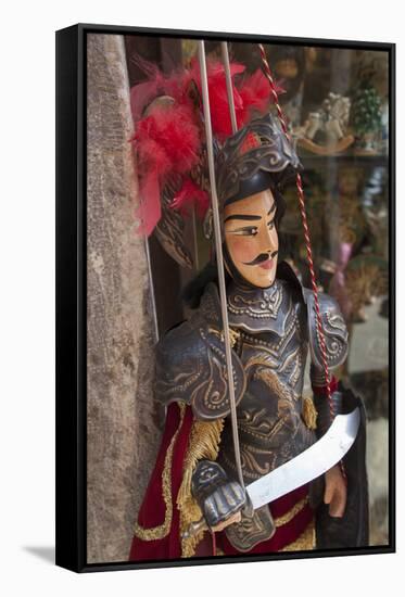 Italy, Sicily, Taormina, knight marionette puppet.-Merrill Images-Framed Stretched Canvas