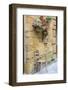 Italy, Tuscany. Chair and flower pots outside the entrance to a shop in a village in Tuscany.-Julie Eggers-Framed Photographic Print