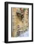 Italy, Tuscany. Chair and flower pots outside the entrance to a shop in a village in Tuscany.-Julie Eggers-Framed Photographic Print