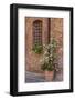 Italy, Tuscany, Crete Senesi, Asciano. Street scene with potted flowers-Julie Eggers-Framed Photographic Print