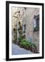 Italy, Tuscany, Crete Senesi, Asciano. Street scene with potted flowers-Julie Eggers-Framed Photographic Print