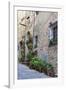 Italy, Tuscany, Crete Senesi, Asciano. Street scene with potted flowers-Julie Eggers-Framed Photographic Print