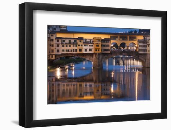 Italy, Tuscany, Florence, Ponte Vecchio reflected in Arno River at dusk.-Merrill Images-Framed Photographic Print