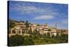 Italy, Tuscany, Montalcino. The hill town of Montalcino as seen from below.-Julie Eggers-Stretched Canvas