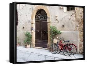 Italy, Tuscany, Pienza. Bicycles Parked Along the Streets of Pienza-Julie Eggers-Framed Stretched Canvas