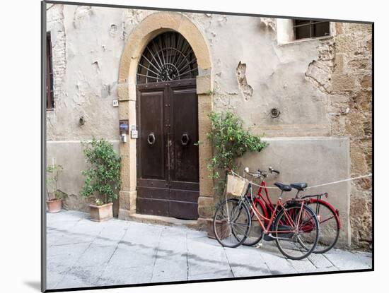 Italy, Tuscany, Pienza. Bicycles Parked Along the Streets of Pienza-Julie Eggers-Mounted Premium Photographic Print