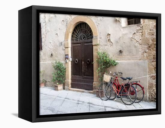 Italy, Tuscany, Pienza. Bicycles Parked Along the Streets of Pienza-Julie Eggers-Framed Stretched Canvas