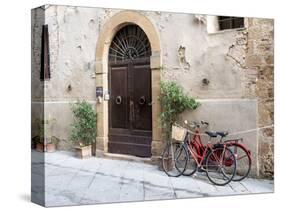 Italy, Tuscany, Pienza. Bicycles Parked Along the Streets of Pienza-Julie Eggers-Stretched Canvas