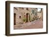 Italy, Tuscany, Pienza. Flower pots and potted plants decorate a narrow street in a Tuscany-Julie Eggers-Framed Photographic Print