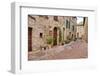 Italy, Tuscany, Pienza. Flower pots and potted plants decorate a narrow street in a Tuscany-Julie Eggers-Framed Photographic Print