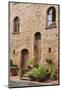 Italy, Tuscany, Pienza. Flower pots and potted plants decorate a narrow street in a Tuscany-Julie Eggers-Mounted Photographic Print