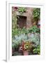 Italy, Tuscany, Pienza. Potted plants in the corner of a street in the town of Pienza.-Julie Eggers-Framed Photographic Print