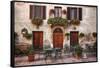 Italy, Tuscany, Pienza. Tables and chairs set up outside for outdoor dining in the town of Pienza.-Julie Eggers-Framed Stretched Canvas