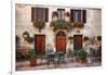 Italy, Tuscany, Pienza. Tables and chairs set up outside for outdoor dining in the town of Pienza.-Julie Eggers-Framed Photographic Print