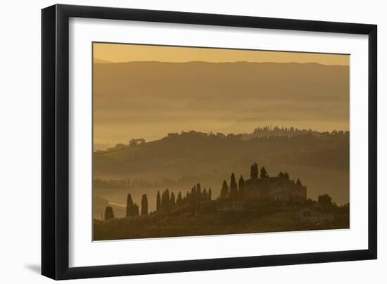 Italy, Tuscany, San Gimignano, farmhouses on ridges with fog at dawn.-Merrill Images-Framed Photographic Print