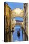 Italy, Veneto, Venice. Bridge of Sighs Illuminated at Dusk with Gondolas-Matteo Colombo-Stretched Canvas