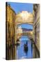 Italy, Veneto, Venice. Bridge of Sighs Illuminated at Dusk with Gondolas-Matteo Colombo-Stretched Canvas