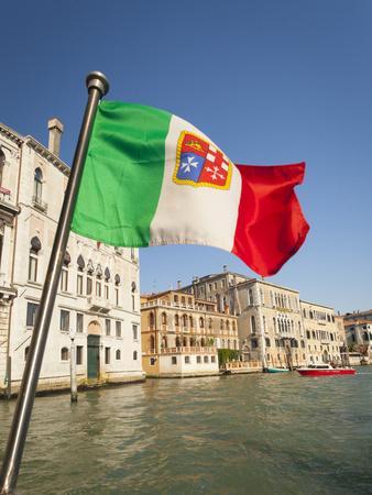 https://imgc.allpostersimages.com/img/posters/italy-venice-italian-flag-with-naval-ensign-flying-above-grand-canal_u-L-Q1GXLDV0.jpg?artPerspective=n