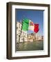 Italy, Venice, Italian flag with Naval ensign flying above Grand Canal.-Merrill Images-Framed Photographic Print