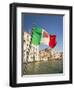 Italy, Venice, Italian flag with Naval ensign flying above Grand Canal.-Merrill Images-Framed Photographic Print