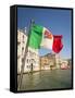 Italy, Venice, Italian flag with Naval ensign flying above Grand Canal.-Merrill Images-Framed Stretched Canvas