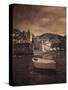 Italy, Vernazza. Infrared image of a boat in the harbor of Vernazza with the church in background.-Terry Eggers-Stretched Canvas