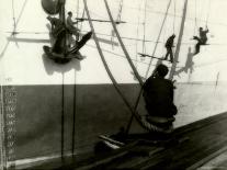 Silhouettes of Workers Using Rope Rigging to Clean and Paint the Side of a Ship-J^ Kauffmann-Laminated Photographic Print