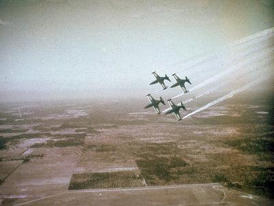 US Navy Stunt Pilots of the Blue Angels Flying their F9F Jets During an Air Show