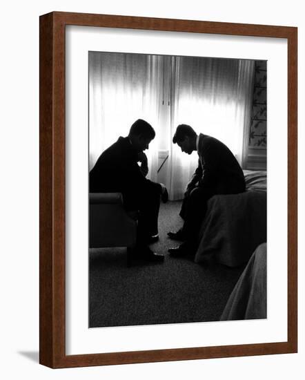 Jack Kennedy Conferring with His Brother and Campaign Organizer Bobby Kennedy in Hotel Suite-Hank Walker-Framed Photographic Print