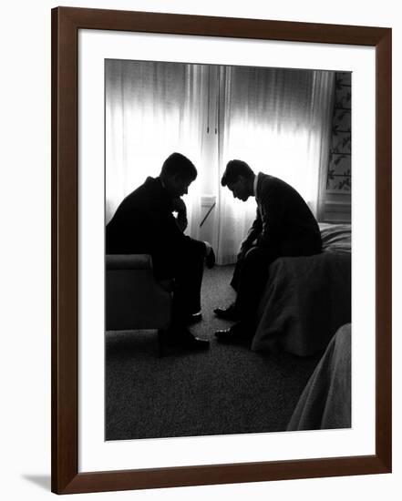 Jack Kennedy Conferring with His Brother and Campaign Organizer Bobby Kennedy in Hotel Suite-Hank Walker-Framed Photographic Print