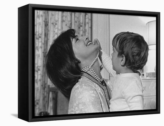 Jackie Kennedy Laughs as Her Son John Jr, Plays with Her Pearl Necklace, Nov.1962-null-Framed Stretched Canvas