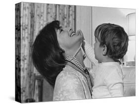 Jackie Kennedy Laughs as Her Son John Jr, Plays with Her Pearl Necklace, Nov.1962-null-Stretched Canvas