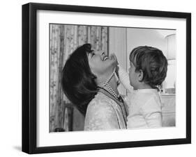 Jackie Kennedy Laughs as Her Son John Jr, Plays with Her Pearl Necklace, Nov.1962-null-Framed Photo