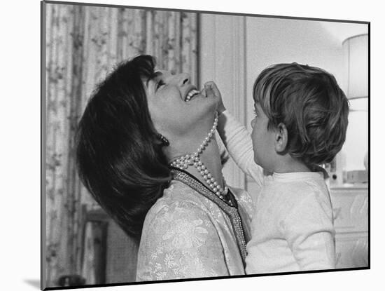 Jackie Kennedy Laughs as Her Son John Jr, Plays with Her Pearl Necklace, Nov.1962-null-Mounted Photo