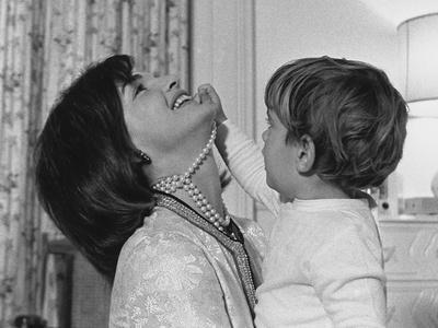 Jackie Kennedy Laughs as Her Son John 
