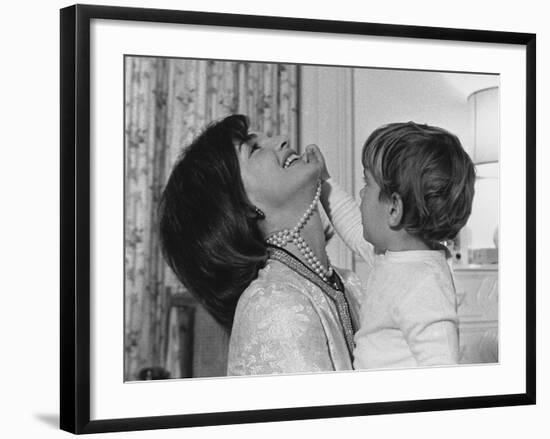 Jackie Kennedy Laughs as Her Son John Jr, Plays with Her Pearl Necklace, Nov.1962-null-Framed Photo