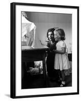 Jackie Kennedy, Wife of Sen, and Daughter Caroline Watching Bird in Cage, at Home-Alfred Eisenstaedt-Framed Photographic Print