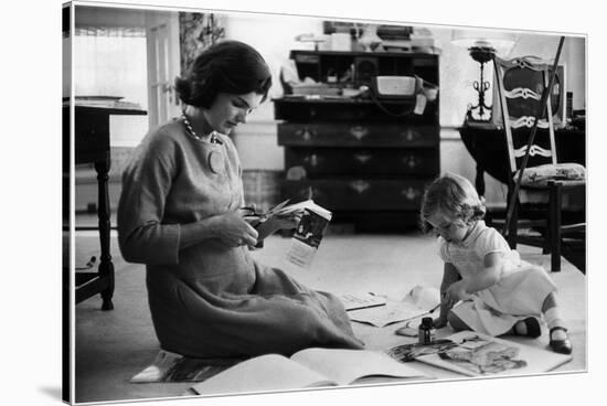 Jackie Kennedy, Wife of Sen, Cutting Out Newspaper Clippings Next to Open Scrapbook-Alfred Eisenstaedt-Stretched Canvas