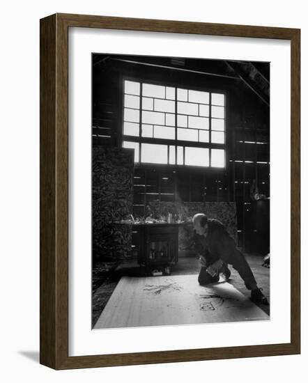 Jackson Pollock Working on a Painting-Martha Holmes-Framed Photographic Print