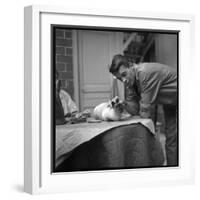 Jacques Brel Cuddling His Cat, September 1959-Marcel Begoin-Framed Photographic Print