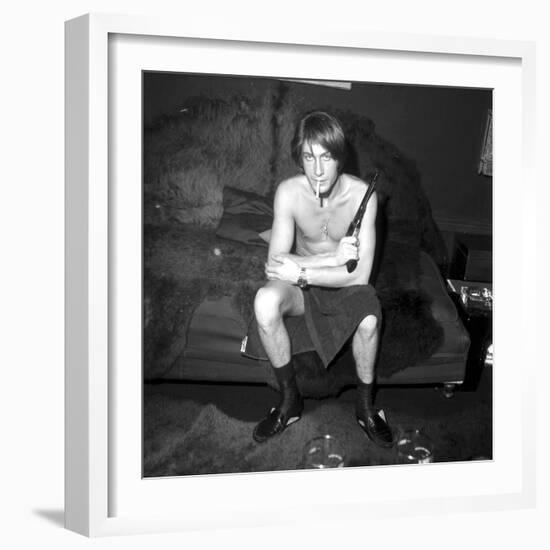 Jacques Dutronc Smoking a Cigarette and Holding a Revolver in 1971-Roldes-Framed Photographic Print