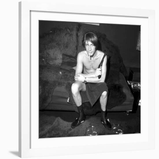 Jacques Dutronc Smoking a Cigarette and Holding a Revolver in 1971-Roldes-Framed Photographic Print