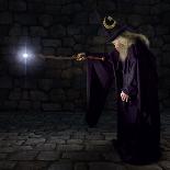 Wizard in a Purple Robe and Wizard Hat Casting a Spell with His Wand-James Steidl-Photographic Print