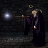 Wizard in a Purple Robe and Wizard Hat Casting a Spell with His Wand-James Steidl-Framed Photographic Print