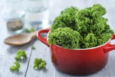 Fresh Kale in a Pot on Gray Wooden Table-Jana Ihle-Photographic Print