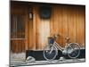 Japan, Chubu Region, Kyoto, Gion, a Bicycle Rests Against the Wall of a Traditional Building-Nick Ledger-Mounted Photographic Print